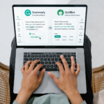 Grammarly vs QuillBot comparison displayed on a laptop screen